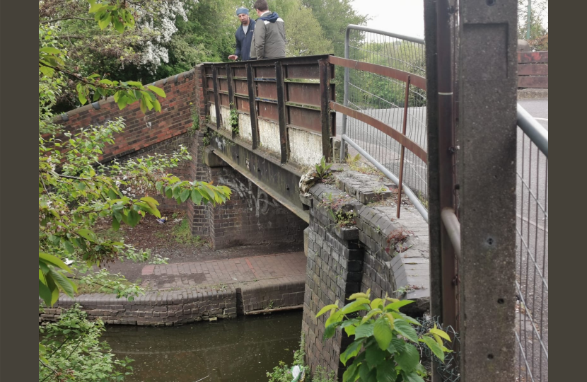 Shaun with a resident on the bridge