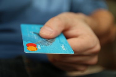 Hand holding a bank card